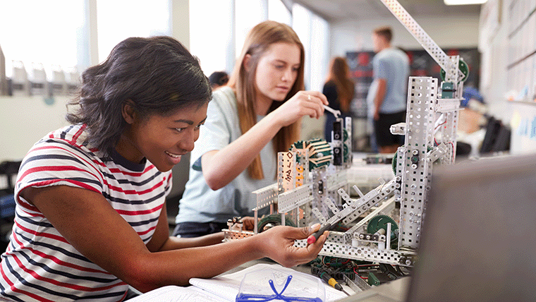 Students working with machinery