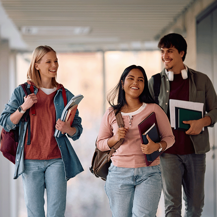 Students walking together holding books